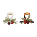 Pinza plástica, cerezas